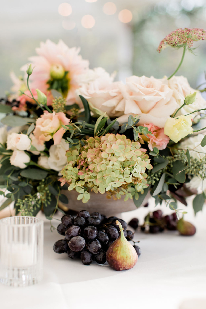 Tuscan inspired wedding centerpieces with florals and fruit